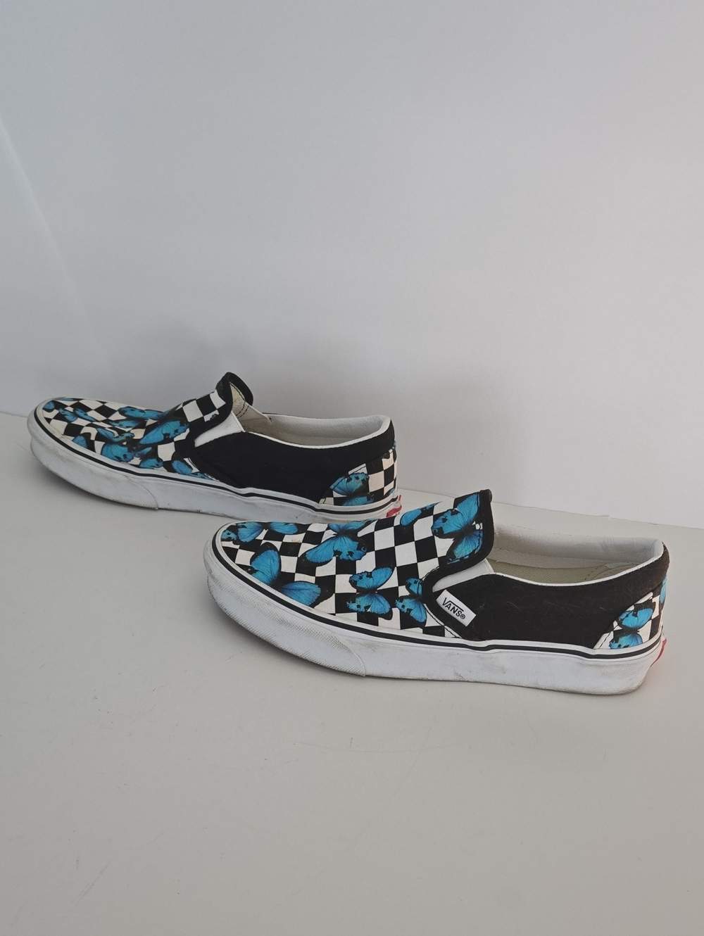 Vans Black & White Checkerboard Slip-Ons with Blue Butterfly Print - Picture 2 of 6